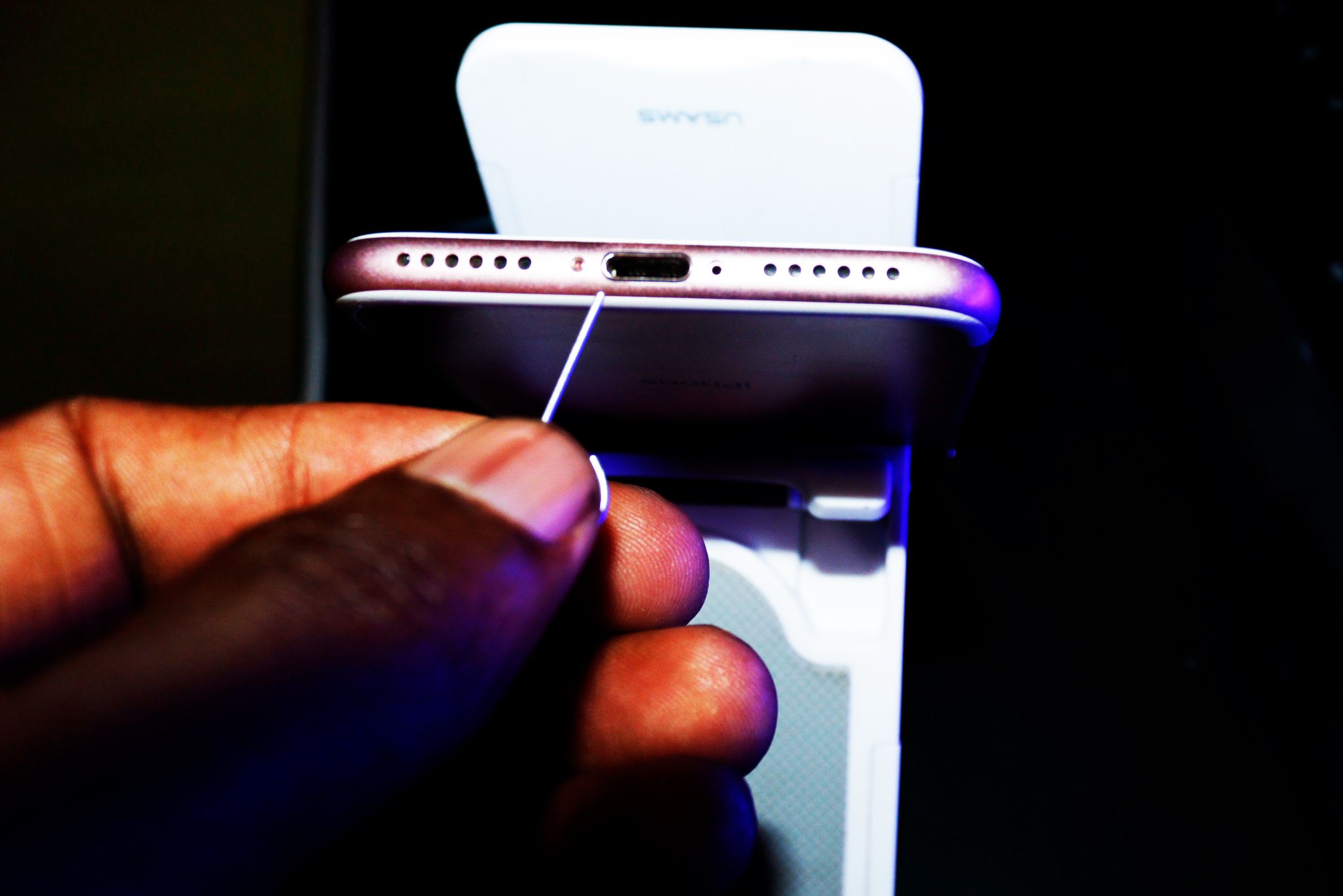 A sharp objected near the charging port of an iPhone